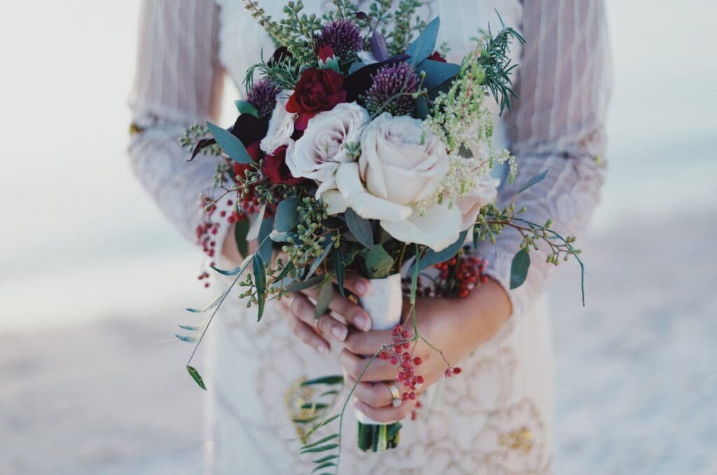 Woman Holding Red and White Rose Bouquet